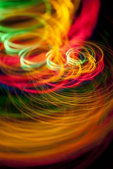 spinning and roating glowing lines of dazzling colour