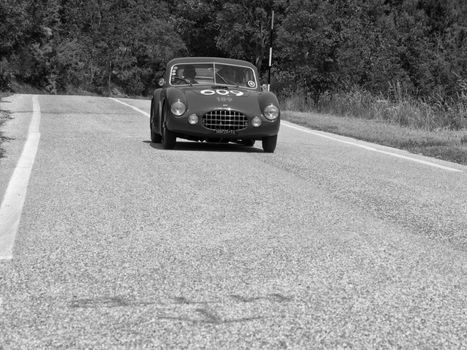 URBINO - ITALY - JUN 16 - 2022 : ERMINI 1100 BERLINETTA MOTTO 1950 on an old racing car in rally Mille Miglia 2022 the famous italian historical race (1927-1957