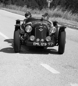 URBINO - ITALY - JUN 16 - 2022 : ASTON MARTIN 2 LITRE SPEED MODEL SPA SPECIAL 1936 on an old racing car in rally Mille Miglia 2022 the famous italian historical race (1927-1957