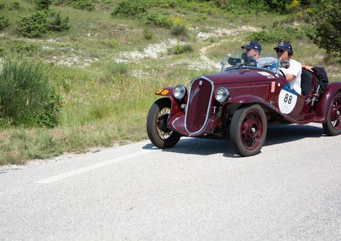URBINO - ITALY - JUN 16 - 2022 : FIAT 508 S BALILLA COPPA D ORO 1934 on an old racing car in rally Mille Miglia 2022 the famous italian historical race (1927-1957