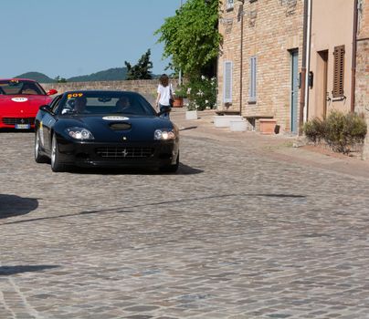 URBINO - ITALY - JUN 16 - 2022 : FERRARI SUPERAMERICA 2005 on an old racing car in rally Mille Miglia 2022 the famous italian historical race (1927-1957