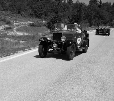 URBINO - ITALY - JUN 16 - 2022 : FIAT 514 S 1931 on an old racing car in rally Mille Miglia 2022 the famous italian historical race (1927-1957