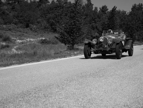 URBINO - ITALY - JUN 16 - 2022 : ALFA ROMEO 6C 1500 SUPER SPORT 1929 on an old racing car in rally Mille Miglia 2022 the famous italian historical race (1927-1957