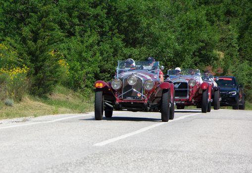 URBINO - ITALY - JUN 16 - 2022 : ALFA ROMEO 6C 1500 SUPER SPORT 1929 on an old racing car in rally Mille Miglia 2022 the famous italian historical race (1927-1957