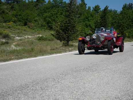 URBINO - ITALY - JUN 16 - 2022 : ALFA ROMEO 6C 1500 SUPER SPORT 1929 on an old racing car in rally Mille Miglia 2022 the famous italian historical race (1927-1957