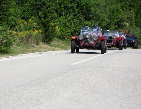 URBINO - ITALY - JUN 16 - 2022 : ALFA ROMEO 6C 1500 SUPER SPORT 1929 on an old racing car in rally Mille Miglia 2022 the famous italian historical race (1927-1957