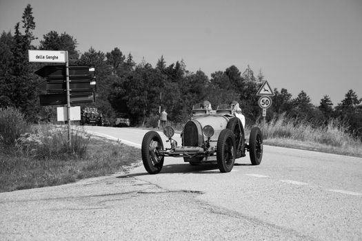 URBINO - ITALY - JUN 16 - 2022 : BUGATTI T35 1925 on an old racing car in rally Mille Miglia 2022 the famous italian historical race (1927-1957