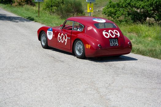 URBINO - ITALY - JUN 16 - 2022 : ERMINI 1100 BERLINETTA MOTTO 1950 on an old racing car in rally Mille Miglia 2022 the famous italian historical race (1927-1957