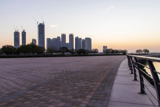 Dubai, UAE - 01.29.2021 Sunrise over Dubai city skyline. Creek Harbor by EMAAR