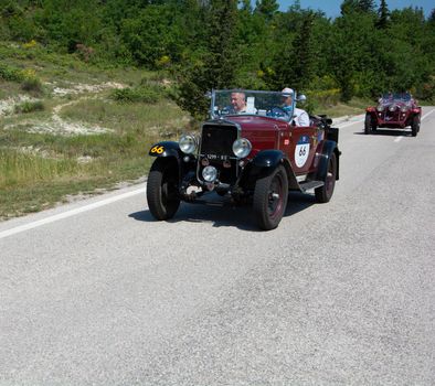 URBINO - ITALY - JUN 16 - 2022 : FIAT 514 S 1931 on an old racing car in rally Mille Miglia 2022 the famous italian historical race (1927-1957