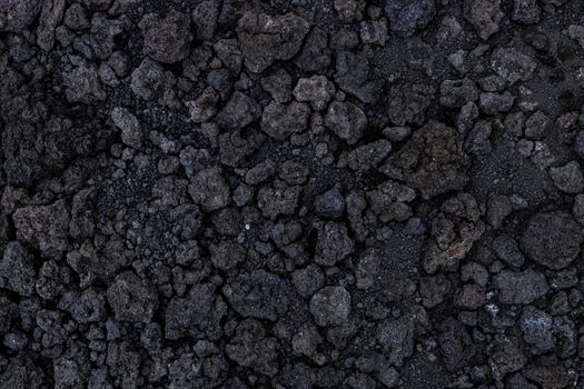 Background texture from volcanic lava stones. Volcanic rock from Etna, Sicily, Italy. High-quality photo