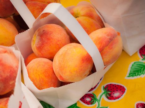 Peaches for sale at a farmer's market.