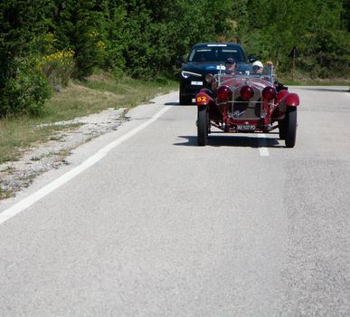 URBINO - ITALY - JUN 16 - 2022 : ALFA ROMEO 6C 1750 SS ZAGATO 1929 on an old racing car in rally Mille Miglia 2022 the famous italian historical race (1927-1957