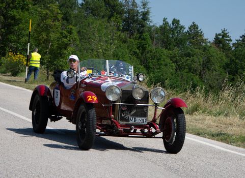 URBINO - ITALY - JUN 16 - 2022 : ALFA ROMEO 6C 1500 SS MM 1928 on an old racing car in rally Mille Miglia 2022 the famous italian historical race (1927-1957