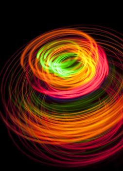 a stylish colorful background image of brighty colored light trails