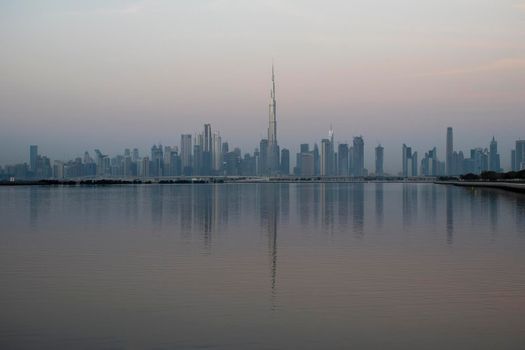 Dubai, UAE - 01.29.2021 Sunrise over Dubai city skyline.