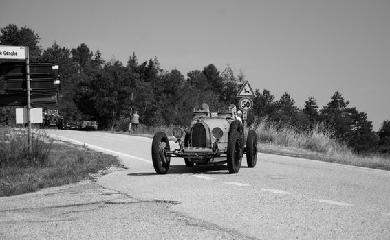 URBINO - ITALY - JUN 16 - 2022 : BUGATTI T35 1925 on an old racing car in rally Mille Miglia 2022 the famous italian historical race (1927-1957