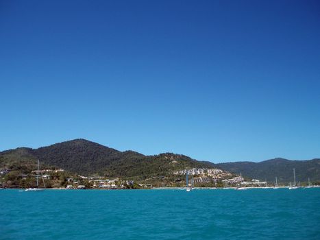 beautiful blue waters and sky, airlie beach on a sunny day, queensland, australia