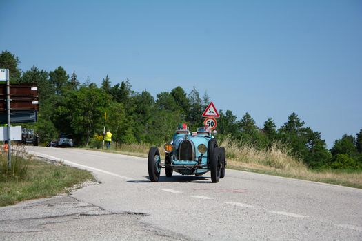 URBINO - ITALY - JUN 16 - 2022 : BUGATTI T35 1925 on an old racing car in rally Mille Miglia 2022 the famous italian historical race (1927-1957