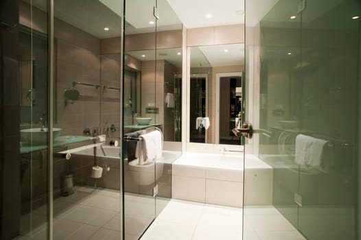 Modern bathroom with lots of glass and white tiles