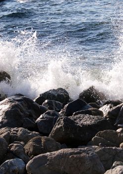 waves breaking over a man made break water