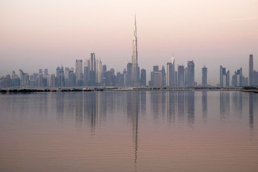 Dubai, UAE - 01.29.2021 Sunrise over Dubai city skyline.