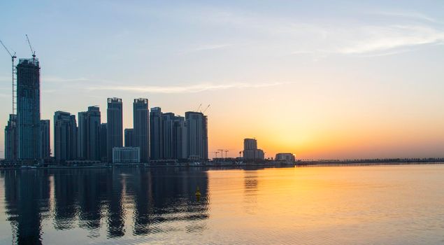 Dubai, UAE - 01.29.2021 Sunrise over Dubai city skyline. Creek Harbor by EMAAR