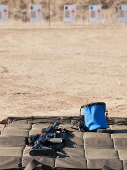 Rifle on the shooting mat with safety on.