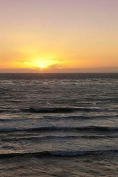 sun setting over the pacific ocean