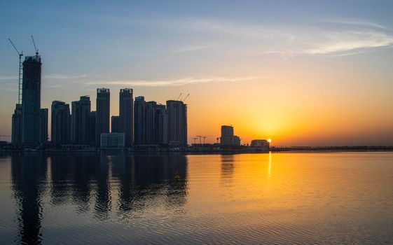 Dubai, UAE - 01.29.2021 Sunrise over Dubai city skyline. Creek Harbor by EMAAR