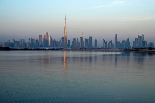 Dubai, UAE - 01.29.2021 Sunrise over Dubai city skyline.