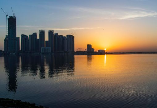 Dubai, UAE - 01.29.2021 Sunrise over Dubai city skyline. Creek Harbor by EMAAR