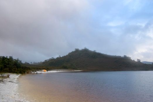 camping on the shores of lake pedder at teds beach