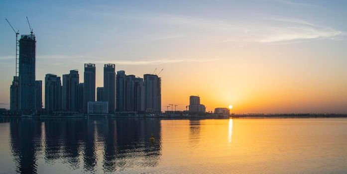 Dubai, UAE - 01.29.2021 Sunrise over Dubai city skyline. Creek Harbor by EMAAR