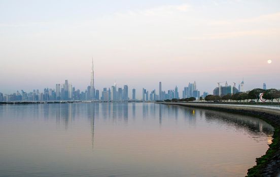 Dubai, UAE - 01.29.2021 Sunrise over Dubai city skyline.