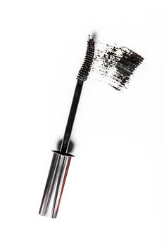 Beauty texture, cosmetic product and art of make-up concept - Black mascara brush stroke close-up isolated on white background