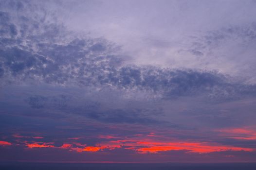 dusk sky glowing bright red as the sun sets