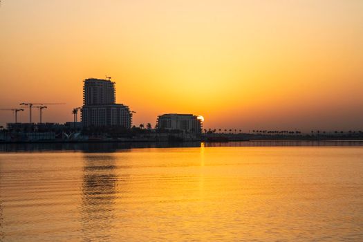 Dubai, UAE - 01.29.2021 Sunrise over Dubai city skyline. Creek Harbor by EMAAR