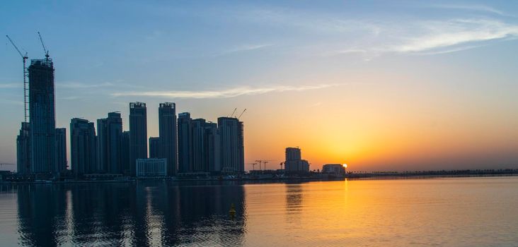 Dubai, UAE - 01.29.2021 Sunrise over Dubai city skyline. Creek Harbor by EMAAR