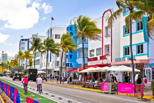 Miami Beach, Florida, USA, March 30 2022: Colorful street of Miami Beach Ocean Drive architecture view, Florida state of USA. Ocean Drive is most famous tourist spot in Miami Beach, and has famous colorful hotels in Art Deco style.