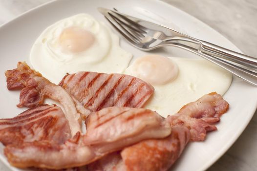 Eggs and bacon on a plate for breakfast