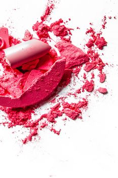 Beauty texture, cosmetic product and art of make-up concept - Crushed eyeshadows, lipstick and powder isolated on white background