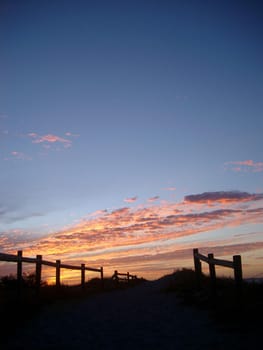 fence sunset silhouette, sand dunes near perth, WA.