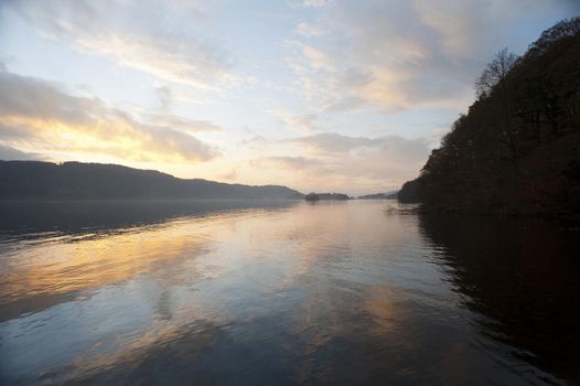 Beautiful tranquil sunset with a delicate color in the sky over Lake Windermere in the English Lake District, Cumbria