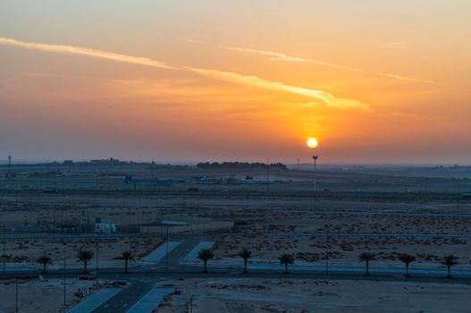 Shot of a sunrise over empty area of the city