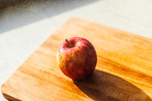 Close up shot of an apple and water droplets in it