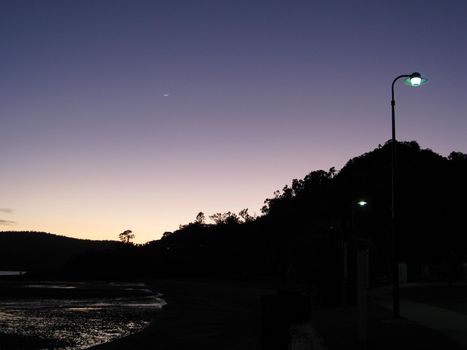 silhouette of a landscape under a twilight sky