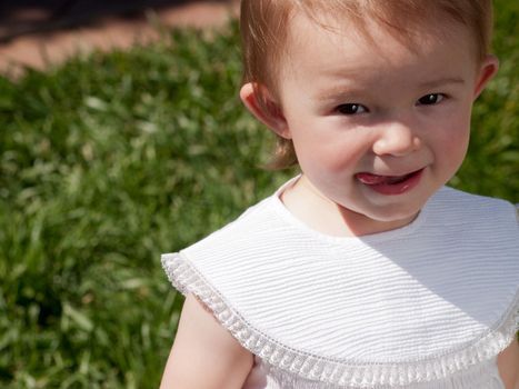 Toddler girl smiling.