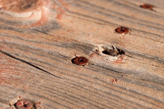 Rusted screws in onld wood.