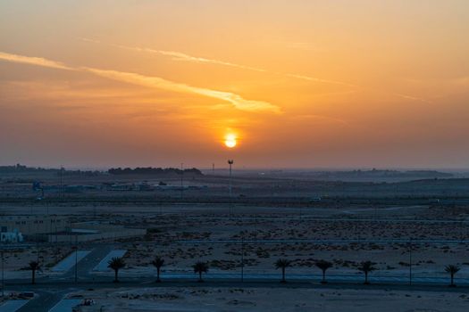 Shot of a sunrise over empty area of the city